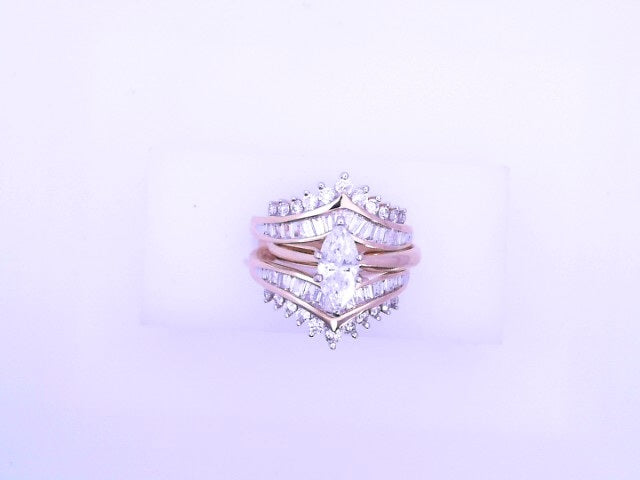14 KARAT RING SIZE 6 WEIGHT: 9.4G : NATURAL DIAMON