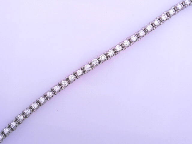 14 KARAT BRACELET LENGTH 7.25 WEIGHT: 11.9G
DIAMO