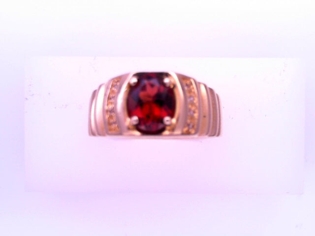 10 KARAT RING SIZE 10 WEIGHT: 5.1G CZ RED OVAL CEN
