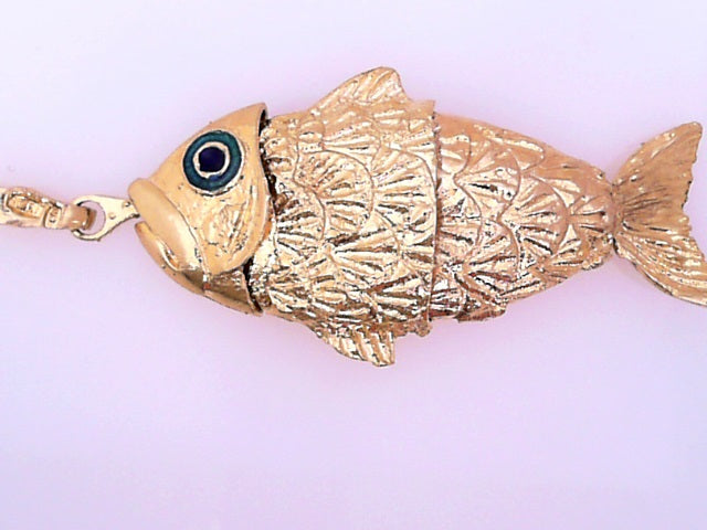 PENDANT 18 KARAT WEIGHT: 22.8G
PUFFY FISH WITH BL