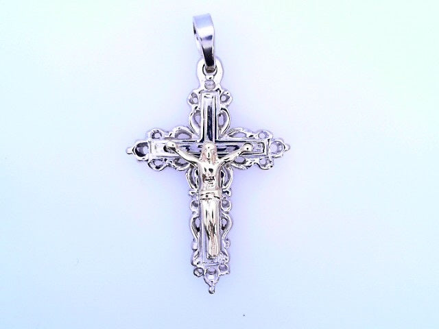 14 KARAT CHARM WEIGHT: 6.6 : CRUCIFIX JESUS TWO TO