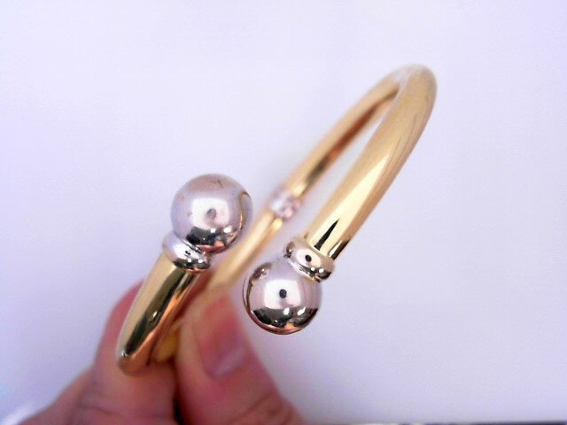 14 KARAT BRACELET WEIGHT: 16.2 : 11.6MM DC BANGLE